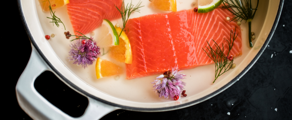 A dish of salmon with garnish