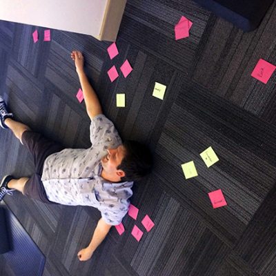UX designer found sleeping amongst his post-its on the office floor