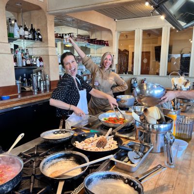 Two mentor employees having fun at a cooking class