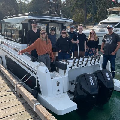 Mentor Creative Group team pictured on the Mentor Ship boat at Blake Island