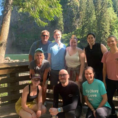 Mentor Creative Group Team posing near the Snoqualmie Falls waterfall